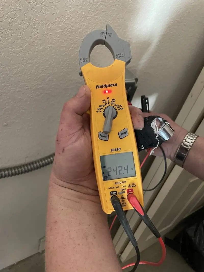 Voltage testing with clamp meter during Electrical Installation Services in Wilson